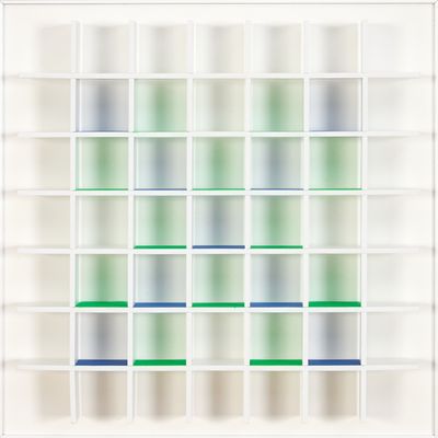 an image of a white bookcase filled with green and blue books