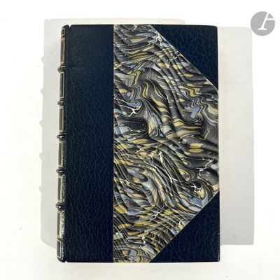 an image of a book with a black cover and a gold and blue cover