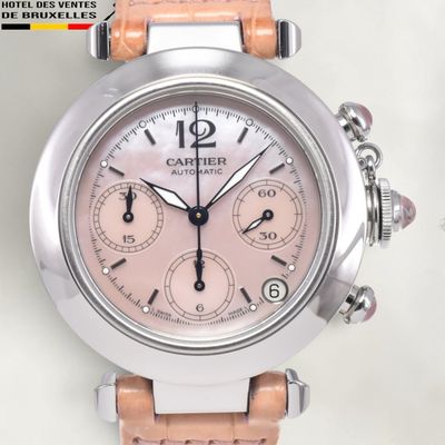 an image of a close up of a wrist watch with a pink dial