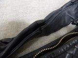a close up of a purse with a zipper on it
