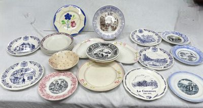 many plates and bowls on a table with a white table cloth