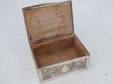a silver box that is sitting on a white surface