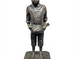 statue of a boy holding a book on a black base