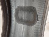 a close up of a tire wheel with a hole in the center