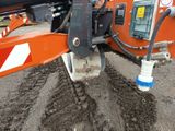 a close up of a machine that is working on the ground