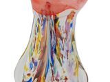 a glass vase that has a colorful design on it