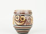 a close up of a cup with a design on it