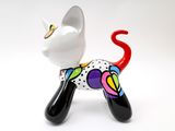 a small figurine of a cat on a white background