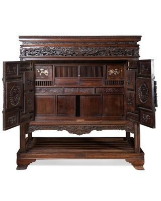 an image of a large wooden cabinet with a door open