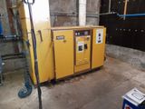 a yellow machine that is sitting in the middle of a room