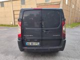 a black van that is parked in a parking lot