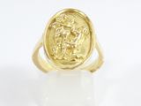 a close up of a gold ring with a lion on it