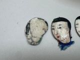 three pieces of art that are sitting on top of a table