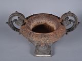 a very old looking vase that is sitting on a table