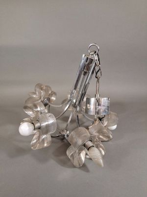 a pair of earrings that are sitting on a table