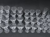 a black and white photo of a bunch of empty wine glasses