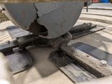 a close up of a piece of metal on the ground