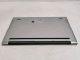 a laptop that is sitting on a white surface