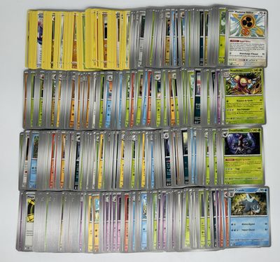 a lot of pokemon cards on the table