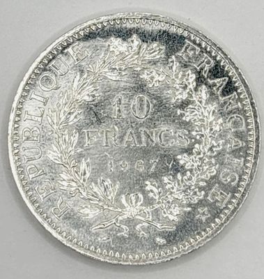 a close up of a coin on a white surface
