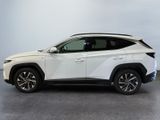 a white toyota rav parked in a room with a gray floor