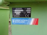a sign on the side of a green machine