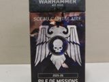 the box of the warhammer card game is sitting on the table