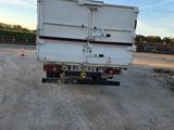 a white truck that is parked on the side of the road