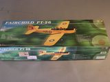 a box with a toy airplane in it sitting on a table