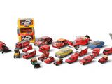 a lot of toy cars and trucks that are on a white surface