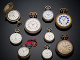 several different types of pocket watches are displayed on a black surface