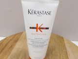 a close up of a tube of kerastasee on a wooden table
