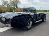 a black sports car parked on the side of the road