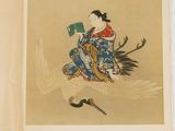 an open book with a picture of a woman sitting on top of a bird