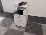 a white printer sitting on top of a black and white printer