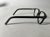 a pair of glasses sitting on a white surface