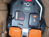 a black and orange robot inside of a cardboard box