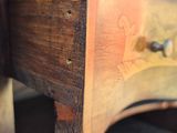 close up of a piece of wood with a drawer underneath it