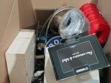 a box with a sign on top of it and a box with a hose