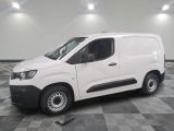 a picture of a white van parked on a checkered floor