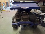 an image of a vehicle being worked on in a garage