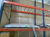 a room with a lot of shelves and a ladder in it