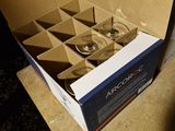 a cardboard box with six glasses inside of it