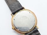 an image of a close up of a wrist watch on a white surface