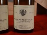 two bottles of wine that are sitting on a table