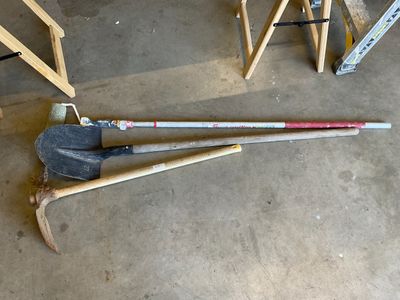 two tools that are laying on the floor