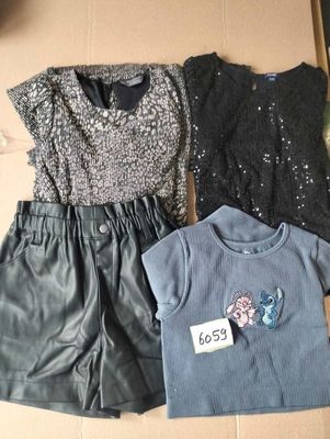 three pieces of clothing sitting on top of a cardboard box