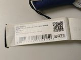 a blue umbrella with a white tag on it