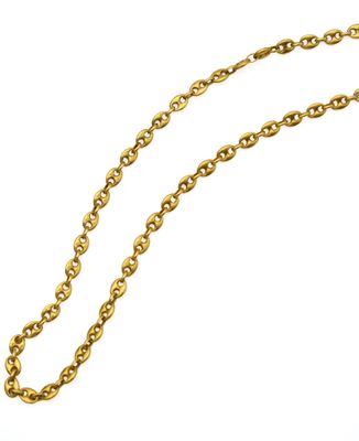 a close up of a gold chain on a white background
