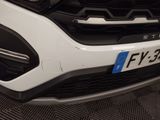 a close up of the front bumper of a white car